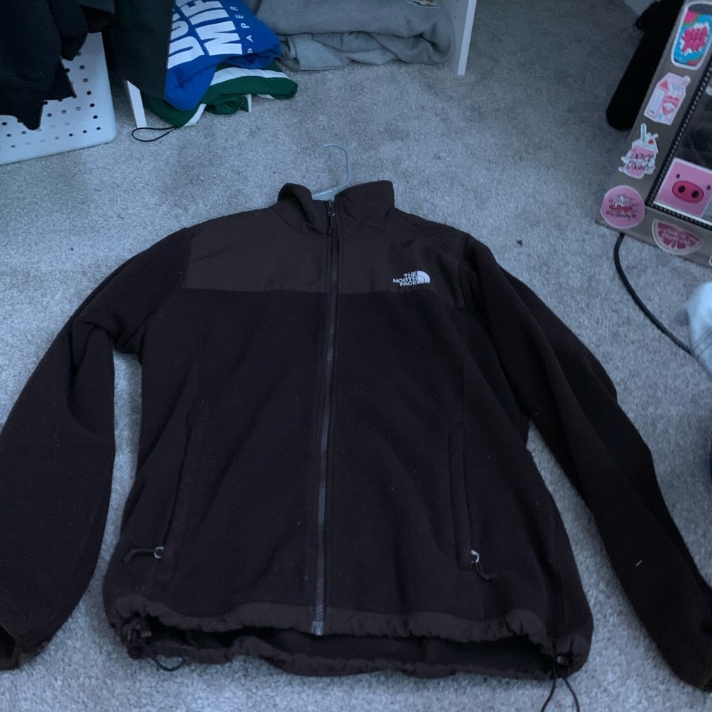 brown north face zip up jacket